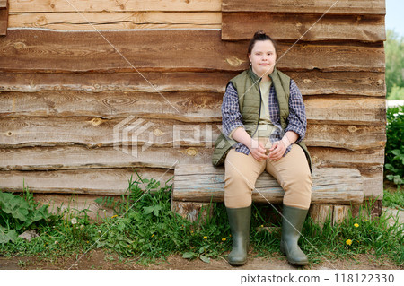 Sitting by Wooden Wall Capturing Rustic Atmosphere 118122330