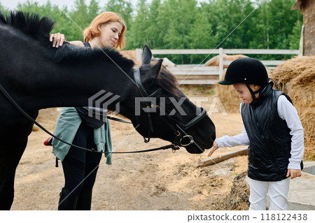 Teaching Child Horse-Riding in Rural Farm Setting 118122438