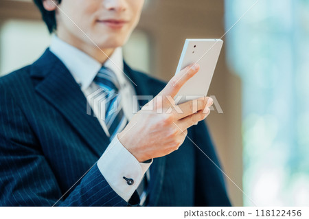 Businessman, smartphone, hand, photo courtesy of Denpa Gakuen, Tokyo Electronics College 118122456