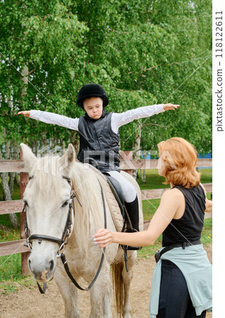 Riding Horse with Equestrian Instructor in Forest Setting 118122611