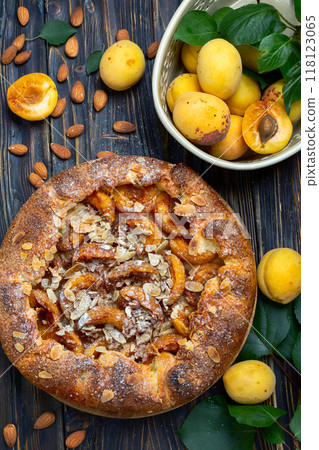 Open pie (galette) with apricots and almonds. Open pie (galette) with apricots and almonds. 118123065