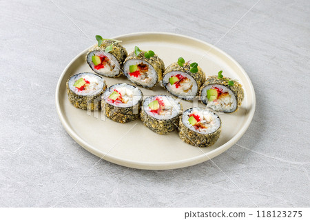Japanese sushi tempura maki crab meat and tobiko roll on slate. Japanese traditional fusion food style, restaurant menu 118123275