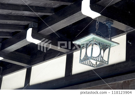 Traditional Japanese architecture: Eaves and lighting fixtures made of solid black wood 118123904