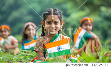 Joyful Children Celebrating India Independence Day with National Flags in Traditional Attire Outdoors 118125115