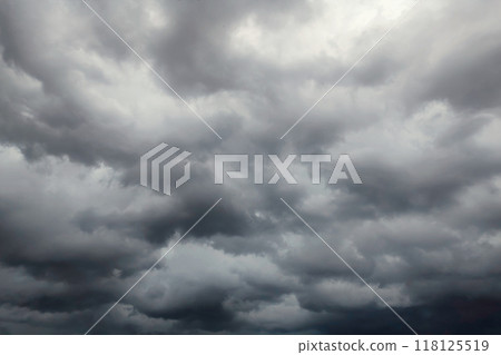 Dark dramatic sky with black stormy clouds before rain or snow as abstract background, extreme weather 118125519