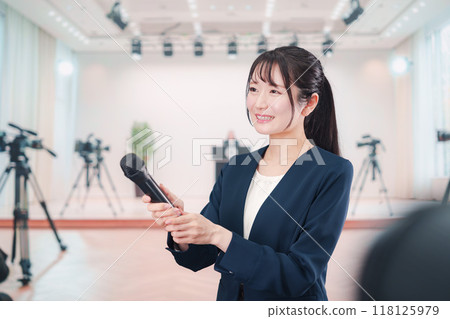 A public relations woman giving an interview in front of the camera A public relations woman giving an interview in front of the camera 118125979