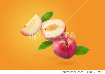 Peach and Peach slice isolater on a orange background Peach and Peach slice isolater on a orange background 118126255