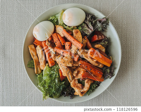 Homemade healthy salad made of boiled eggs chicken breasts carrots. 118126596