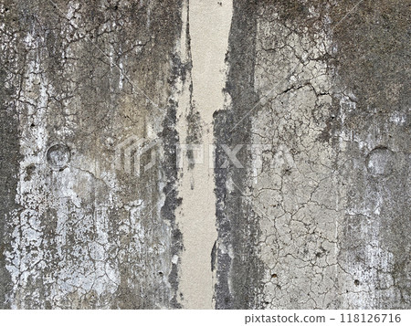 A deteriorated concrete wall in a 60-year-old building. 118126716