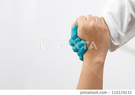 Doctor holding hands to encourage patients 118129232
