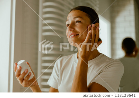 Skincare Routine Applying Moisturizer Daily for a Healthy and Radiant Complexion 118129641