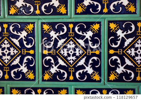Ancient Fireplace Facing Glazed Tiles in Old Town Mir, Belarus. 118129657