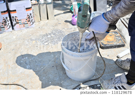 Painter mixing paint, house, exterior wall painting 118129678