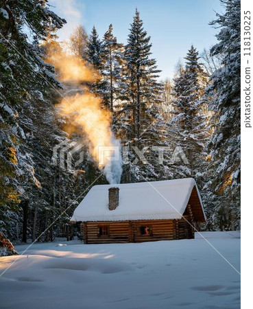 A remote cabin in the woods surrounded by deep snow 118130225