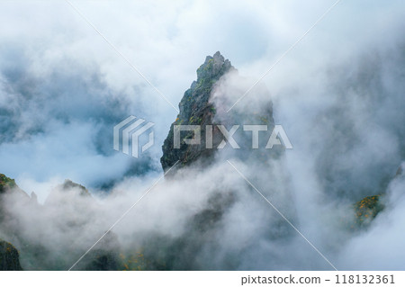 A mountain covered in fog and clouds. Madeira island, Portugal 118132361