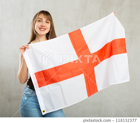 Young happy pretty woman displaying flag of england 118132377
