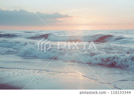 Golden sunset over foamy ocean waves on sandy shore 118133344