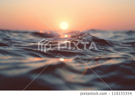 Close up of ocean wave at sunset with colorful sky 118133354