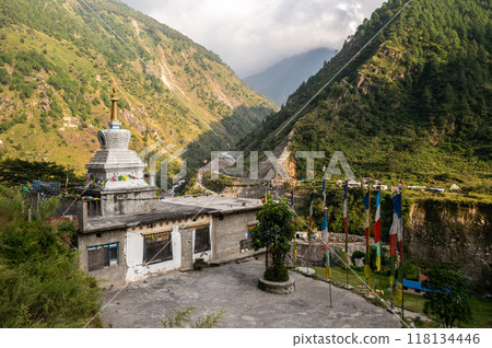 Tibetan Buddhist pagoda in Syabrubesi village a beautiful resident village inside the Langtang National Park of Nepal. Tibetan Buddhist pagoda in Syabrubesi village a beautiful resident village inside the Langtang National Park of Nepal. 118134446
