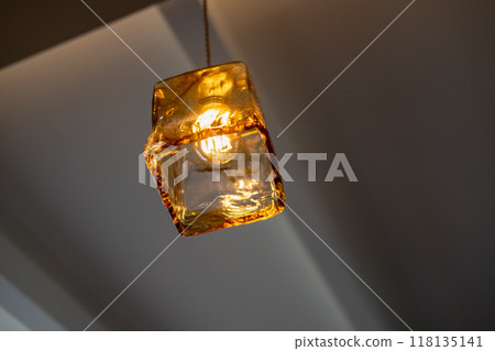Hanging Edison light bulb, also known as filament light bulb. with glass shade Hanging Edison light bulb, also known as filament light bulb. with glass shade 118135141