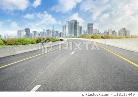 Smart city with empty road leading to cityscape 118135449