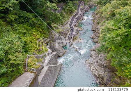 Tama River: View of the fishway below the dam from the Shiromaru Adjustment Pond Dam 118135779