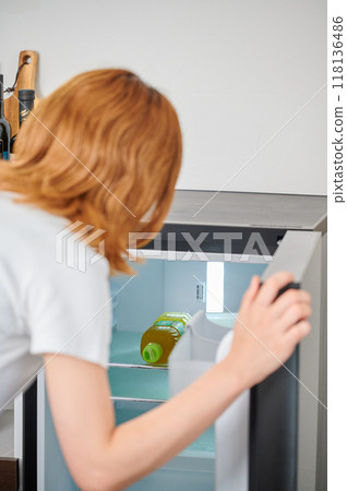 Woman opening the refrigerator, housework, lifestyle, living Woman opening the refrigerator, housework, lifestyle, living 118136486