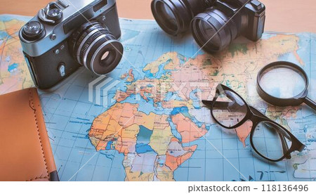 A map and a camera laid out on the table 118136496