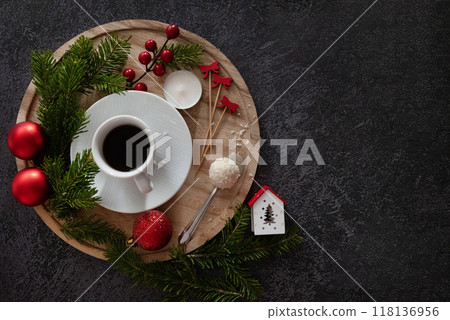 Home 2025 theme white coffee cup with number 2024 over frothy surface flat lay on green background with wooden house model, green plant, coffee beans and star anise. New year's resolutions for family. Home 2025 theme white coffee cup with number 2024 over frothy surface flat lay on green background with wooden house model, green plant, coffee beans and star anise. New year's resolutions for family. 118136956