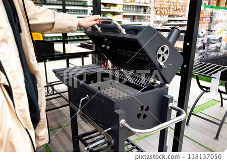 Outdoor modern black grill on display in a retail store. 118137050