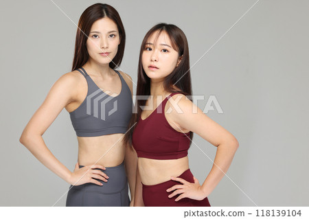 Women in yoga wear Women in yoga wear 118139104