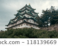 A cinematic-style picture of majestic Nagoya Castle, crowned with golden shachihoko, reflects Japan's rich history and the beauty of its Edo-era architecture, surrounded by serene gardens. 118139669