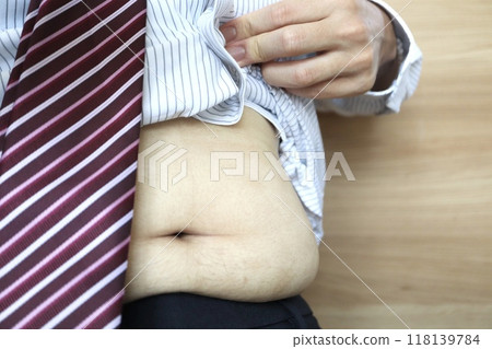 Obese businessman's belly 118139784