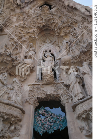 Part of the Nativity façade of the Sagrada Familia, with its gates and sculptures Part of the Nativity façade of the Sagrada Familia, with its gates and sculptures 118140518