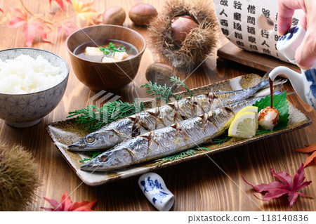 Autumn flavors: grilled salted saury, chestnuts, miso soup and rice Autumn flavors: grilled salted saury, chestnuts, miso soup and rice 118140836