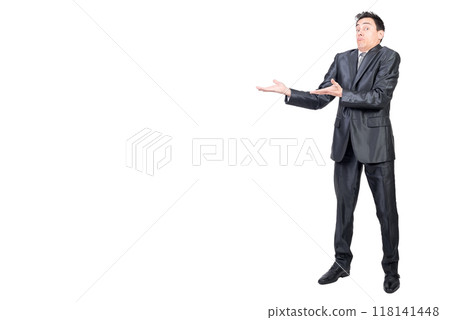Astonished man in suit pointing aside. White background. Astonished man in suit pointing aside. White background. 118141448