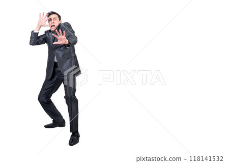 Terrified man in light studio. White background. 118141532