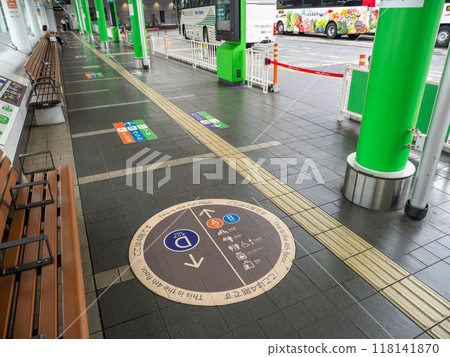 Guide signs installed on the floor of the corridor inside the express bus terminal 118141870