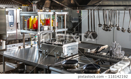 Modern Restaurant Kitchen with Professional Equipment. Concept of highend culinary space 118142192