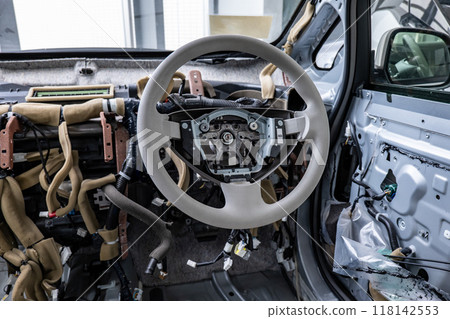 Interior of an electric car disassembled for maintenance Interior of an electric car disassembled for maintenance 118142553