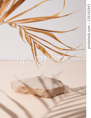 Smooth, uneven beige stone slab on a textured light background with a soft shadow Smooth, uneven beige stone slab on a textured light background with a soft shadow 118142841
