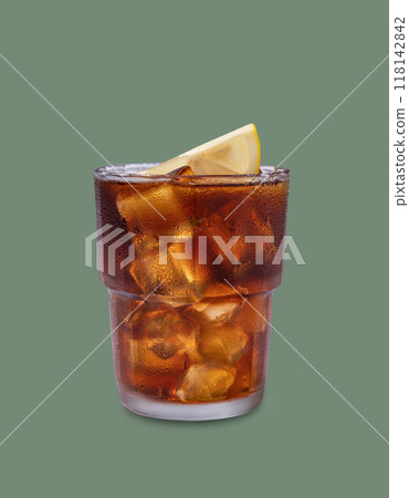 Iced tea, Cuba Libre or Long Island cocktail with cola, lemon and ice in a glass on green background Iced tea, Cuba Libre or Long Island cocktail with cola, lemon and ice in a glass on green background 118142842
