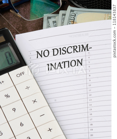 Conceptual no discrimination symbol. Copy space. No discrimination words written in a notebook in a ruler on a blank sheet Conceptual no discrimination symbol. Copy space. No discrimination words written in a notebook in a ruler on a blank sheet 118143837