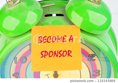 Business and Become a sponsor concept. Copy space. Concept word BECOME A SPONSOR on the sticker on the background of the alarm clock Business and Become a sponsor concept. Copy space. Concept word BECOME A SPONSOR on the sticker on the background of the alarm clock 118143869