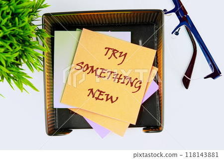 Business, time for something new concept. TRY SOMETHING NEW on the sticker in the stand, top view 118143881