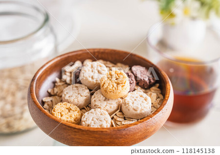 Sweets and oatmeal in a wooden bowl 118145138