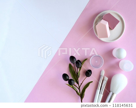 Cosmetic refill case with makeup brushes and sponges on a pink background Cosmetic refill case with makeup brushes and sponges on a pink background 118145631