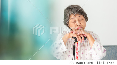 Senior woman sticking her head Senior woman sticking her head 118145752