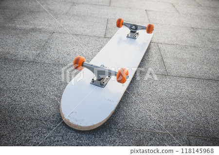 Skateboard outdoors in sunrise city 118145968