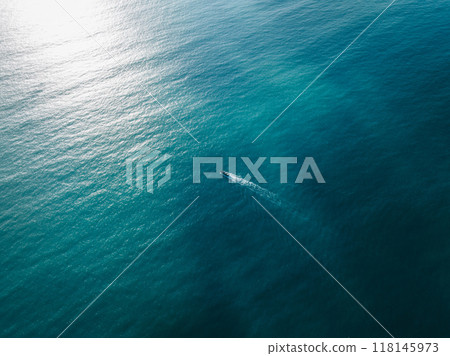 Jet boat sailing in sunrise sea Jet boat sailing in sunrise sea 118145973